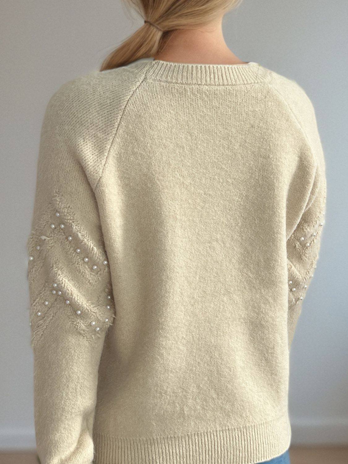 Eleganter Pullover mit Perlendetails